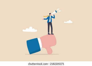 Discredit or blame other people, bullying and discourage speaking, fake news or negative feedback concept, bad businessman with megaphone discredit and blaming other people on thumb down symbol.