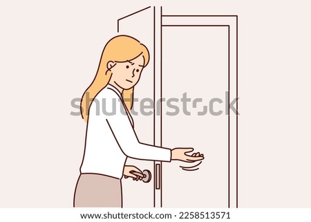 Disgruntled woman secretary invites to enter room opening door for unpleasant person or rival at work. Girl secretary with frown makes inviting hand gesture to ask unwanted visitor or client to leave