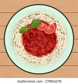 A dish of pasta with Bolognese sauce. Plate stands on a wooden surface. Top view.