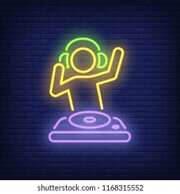 Disk jokey with dj mixer neon sign. Music, party and sound concept. Advertisement design. Night bright neon sign, colorful billboard, light banner. Vector illustration in neon style.