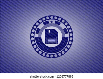 diskette icon inside badge with denim texture