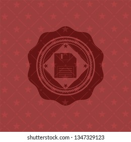 diskette icon inside badge with red background