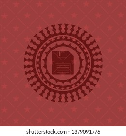 diskette icon inside badge with red background