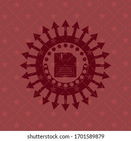 diskette icon inside badge with red background