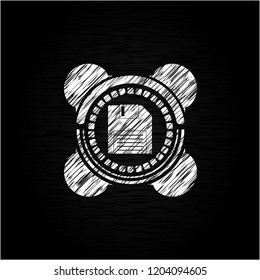 diskette icon inside chalk emblem written on a blackboard