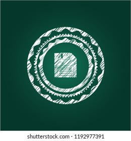 diskette icon inside chalkboard emblem written on a blackboard