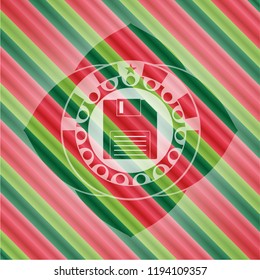 diskette icon inside christmas badge background.