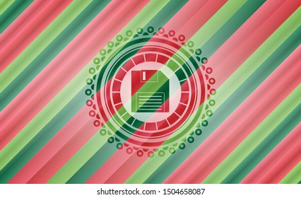 diskette icon inside christmas colors style badge.