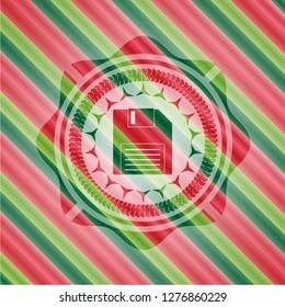 diskette icon inside christmas emblem.