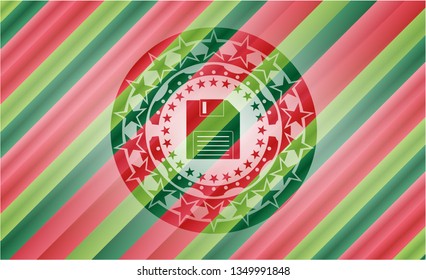 diskette icon inside christmas emblem.