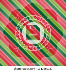 diskette icon inside christmas style emblem.
