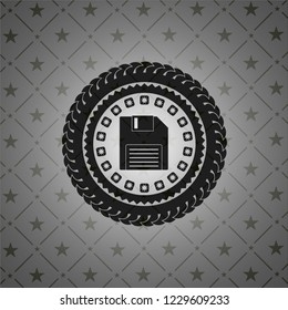 diskette icon inside dark badge