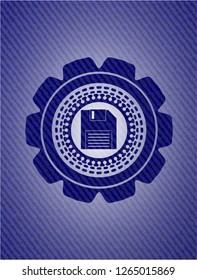 diskette icon inside emblem with denim texture