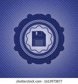 diskette icon inside emblem with denim texture