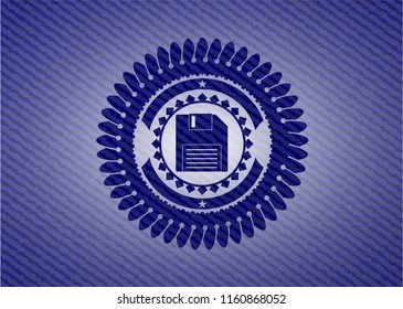 diskette icon inside emblem with jean background