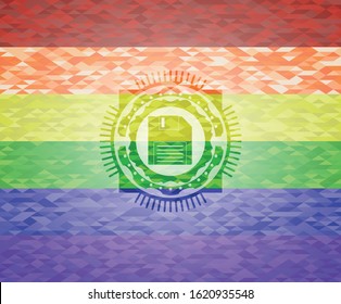 diskette icon inside emblem on mosaic background with the colors of the LGBT flag