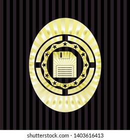 diskette icon inside gold emblem