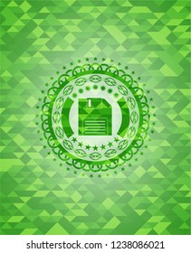 diskette icon inside green mosaic emblem