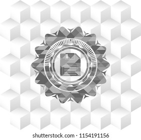 diskette icon inside grey badge with geometric cube white background