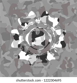 diskette icon inside grey camo emblem