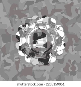 diskette icon inside grey camo emblem. 