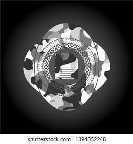 diskette icon inside grey camouflage emblem