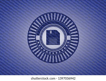 diskette icon inside jean or denim emblem or badge background