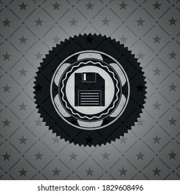diskette icon inside realistic dark emblem. 