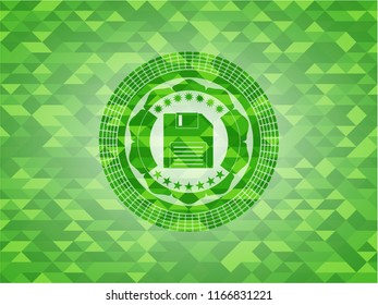 diskette icon inside realistic green mosaic emblem