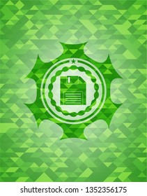 diskette icon inside realistic green mosaic emblem