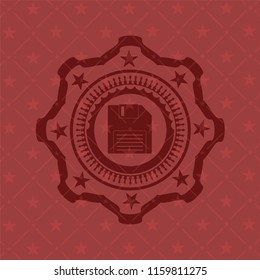 diskette icon inside red emblem
