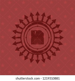 diskette icon inside retro red emblem