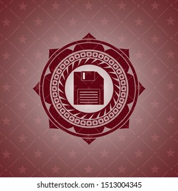 diskette icon inside retro red emblem