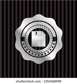 diskette icon inside silver badge or emblem