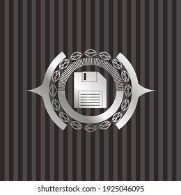 diskette icon inside silver badge or emblem. 
