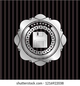 diskette icon inside silver emblem or badge