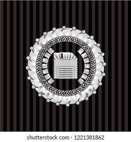 diskette icon inside silver emblem