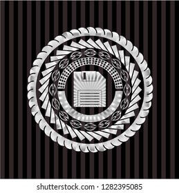 diskette icon inside silvery badge or emblem