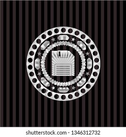 diskette icon inside silvery badge or emblem