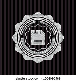 diskette icon inside silvery emblem