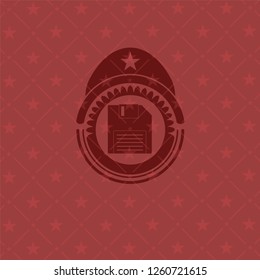 diskette icon inside vintage red emblem