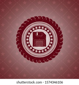diskette icon inside vintage red emblem