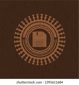 diskette icon inside vintage wood emblem