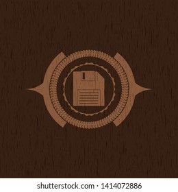 diskette icon inside vintage wood emblem