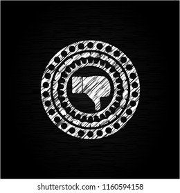 dislike icon inside chalkboard emblem on black board