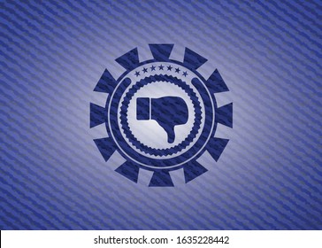 dislike icon inside emblem with jean background