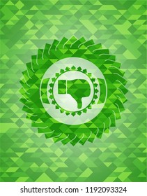 dislike icon inside green emblem with triangle mosaic background