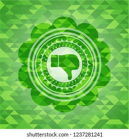 dislike icon inside green emblem with mosaic ecological style background