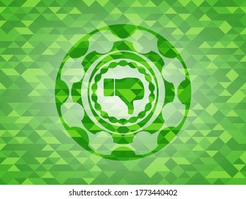 dislike icon inside green emblem with mosaic background. 