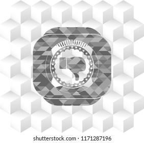 dislike icon inside grey emblem with cube white background